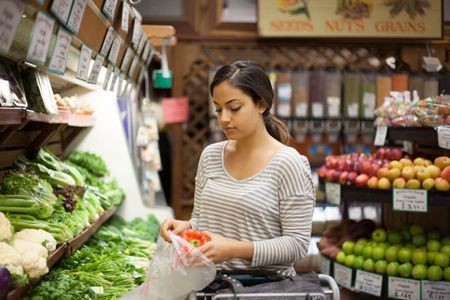 Shopper selecting fresh local produce
