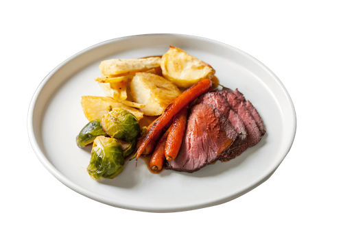 a white plate topped with meat potatoes and carrots