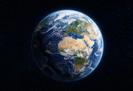 Earth from space, showing Europe, Africa, and city lights.