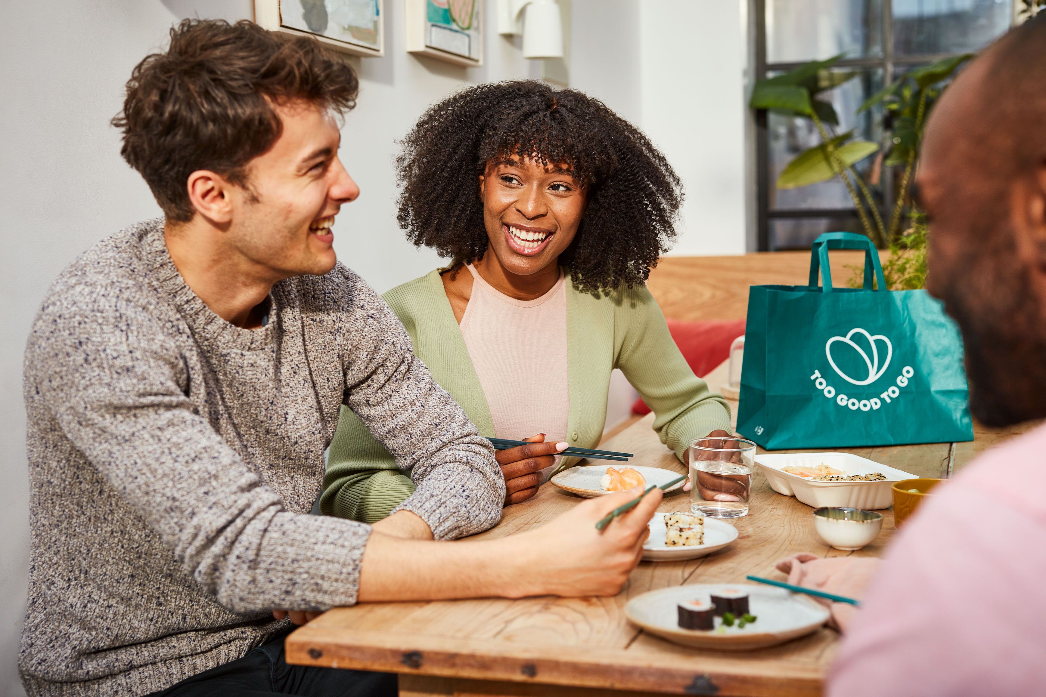 Two people sharing Too Good To Go surprise bag