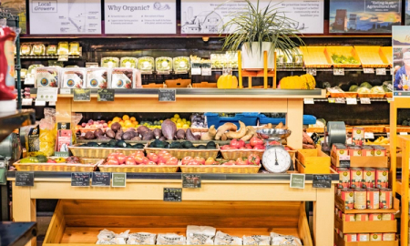 a sign in a grocery store explains why organic