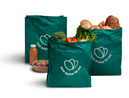 trois sacs verts contenant de la nourriture avec écrit Too Good To Go dessus
