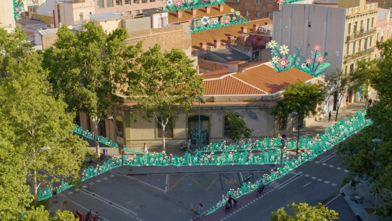 an aerial view of a city street with trees and flowers .