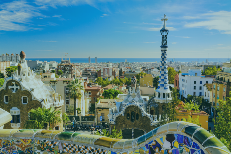 a cityscape with a blue and white tower in the foreground