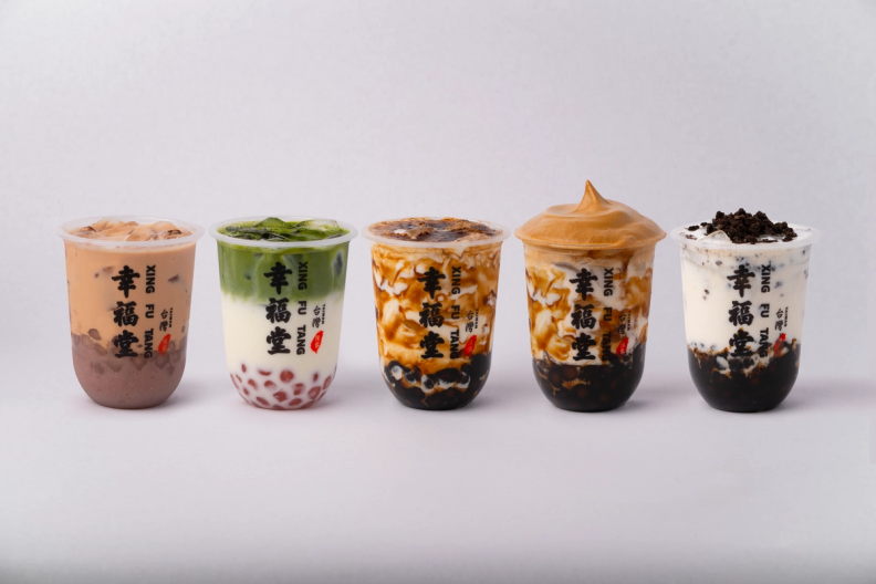Five assorted Xing Fu Tang bubble tea drinks, including matcha, brown sugar, and cookies and cream.