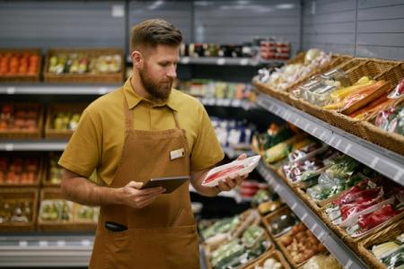 Grocery employee checking inventory