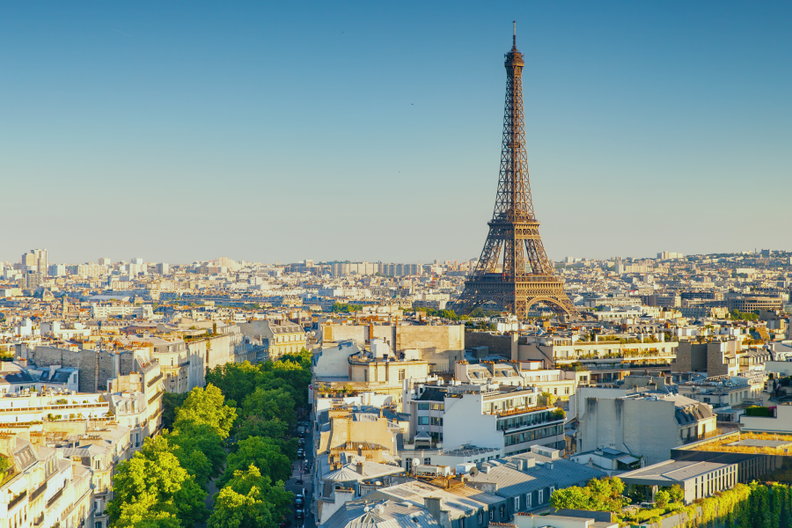 the eiffel tower is visible over the city of paris