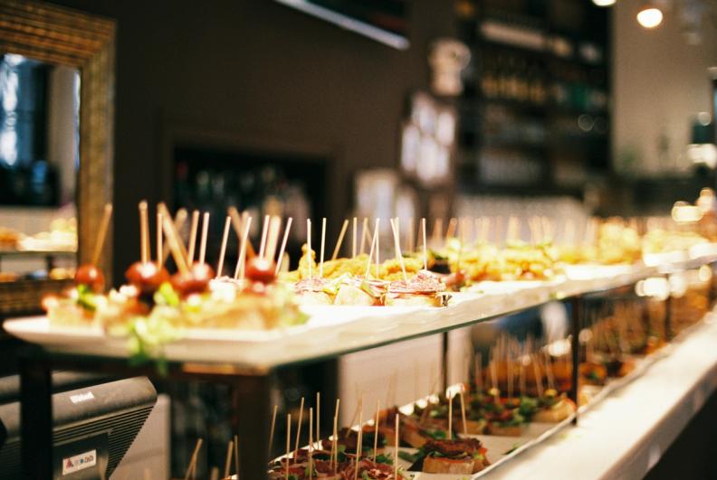plates containing food lined up in a long display