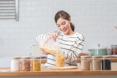 Woman organizing pantry.