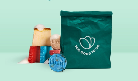 a green bag that says too good to go on it with Lush products next to it.