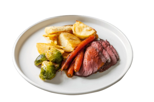 a white plate topped with meat potatoes and carrots