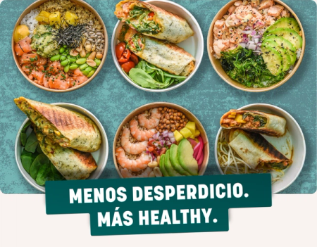 Six diverse healthy food bowls and wraps on a blue background. A green banner reads "MENOS DESPERDICIO. MÁS HEALTHY." (Less Waste. More Healthy.).