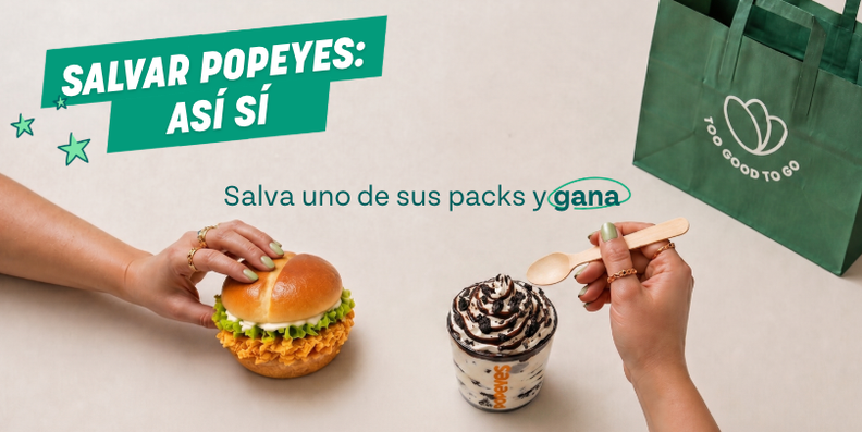 Two hands holding a Popeyes sandwich and a dessert cup with a spoon, next to a Too Good To Go bag. Text: "SALVAR POPEYES: ASÍ SÍ. Salva uno de sus packs y gana."