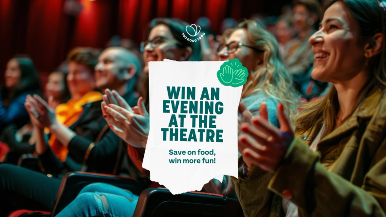 a group of people clapping in a theater with a sign that says win an evening at the theatre