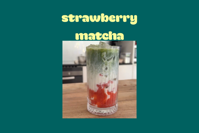 a strawberry matcha drink in a tall glass