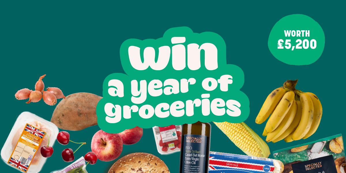 a green sign that says win a year of groceries