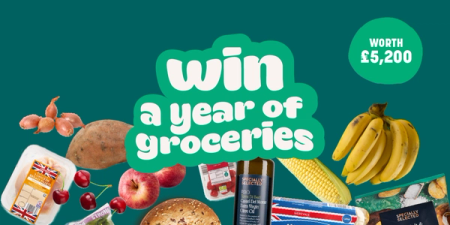 a green sign that says win a year of groceries