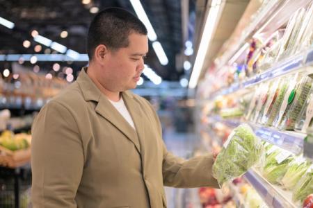 Checking packaged lettuce freshness