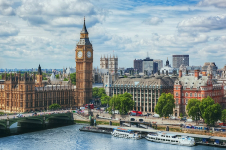 the big ben clock tower is in the middle of a city