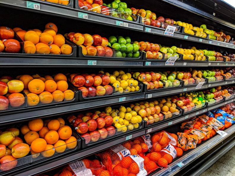 Shelves full of fresh produce at a grocery store