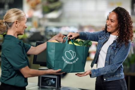 Employee assisting customer in store