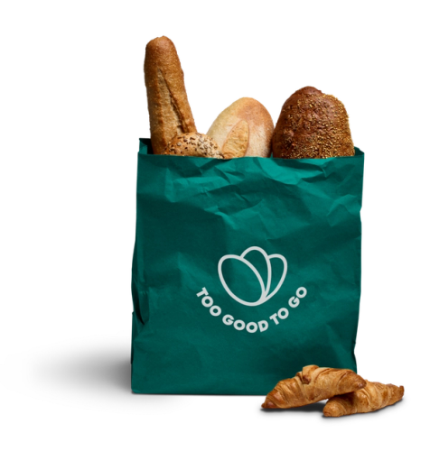a green bag containing bread that says Too Good To Go on it