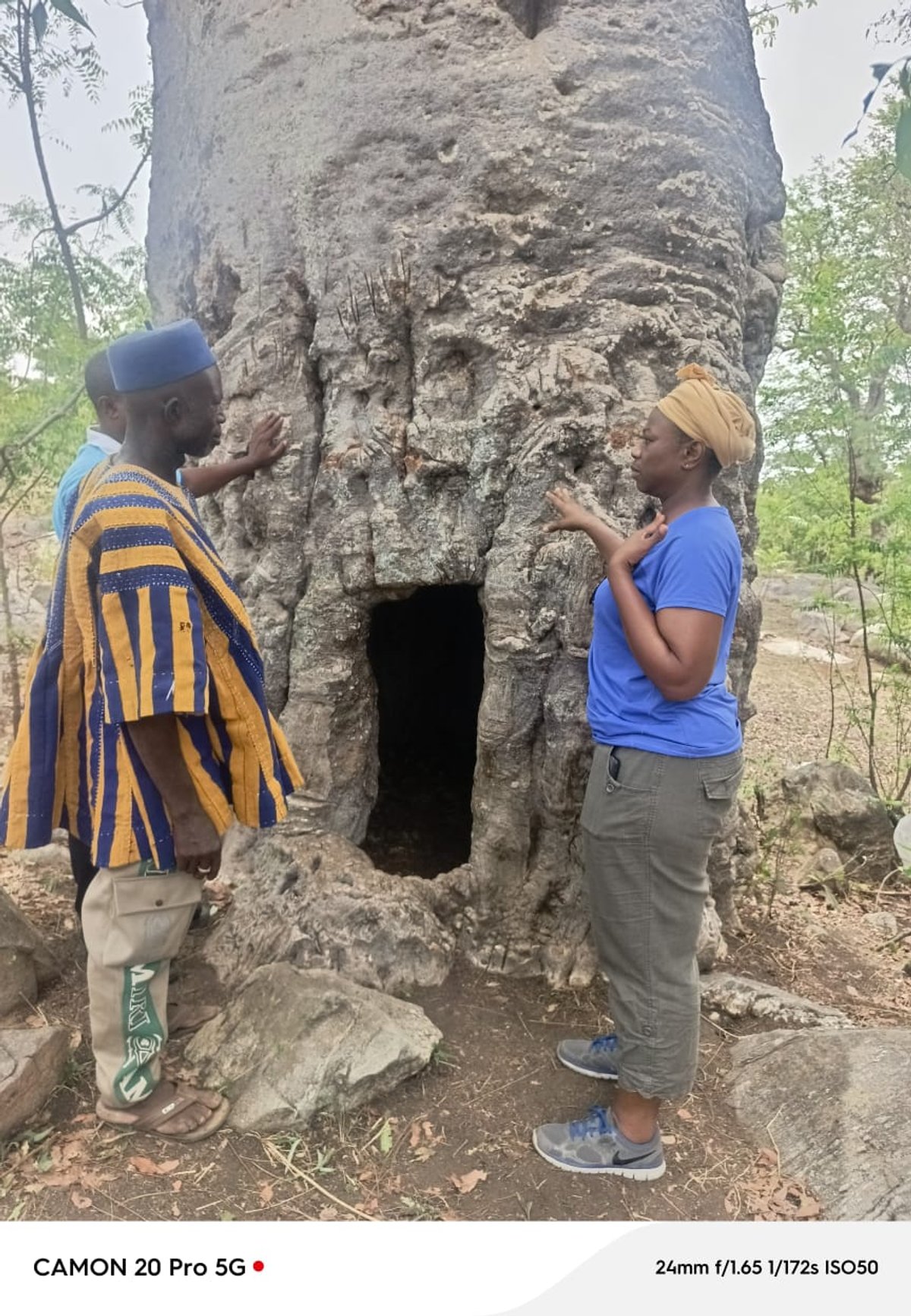 Close-up of the historic Baobab tree in Busa with KAPAW team members