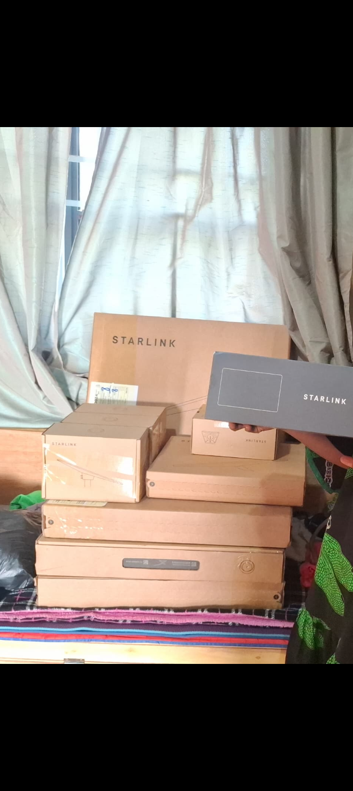 Stacked Starlink equipment boxes ready for distribution to schools