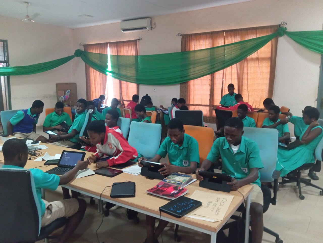 Students learning on tablets in Kumasi digital literacy lab