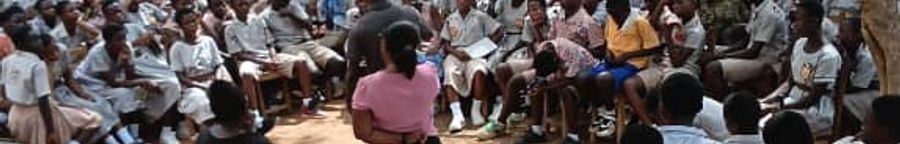 Large group of students gathered for career guidance under trees