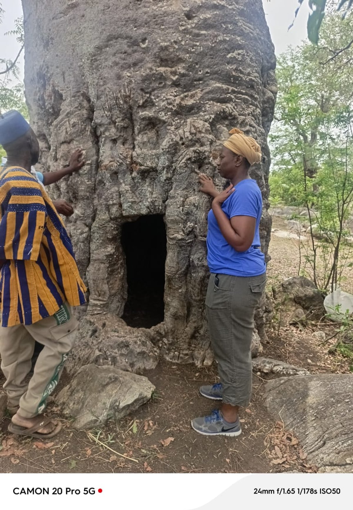 Historic Baobab tree in Busa, Upper West Region, with community members