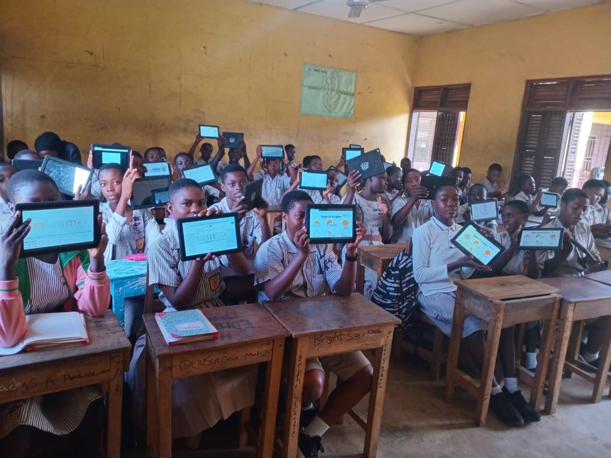 Students holding up tablets displaying maths learning content