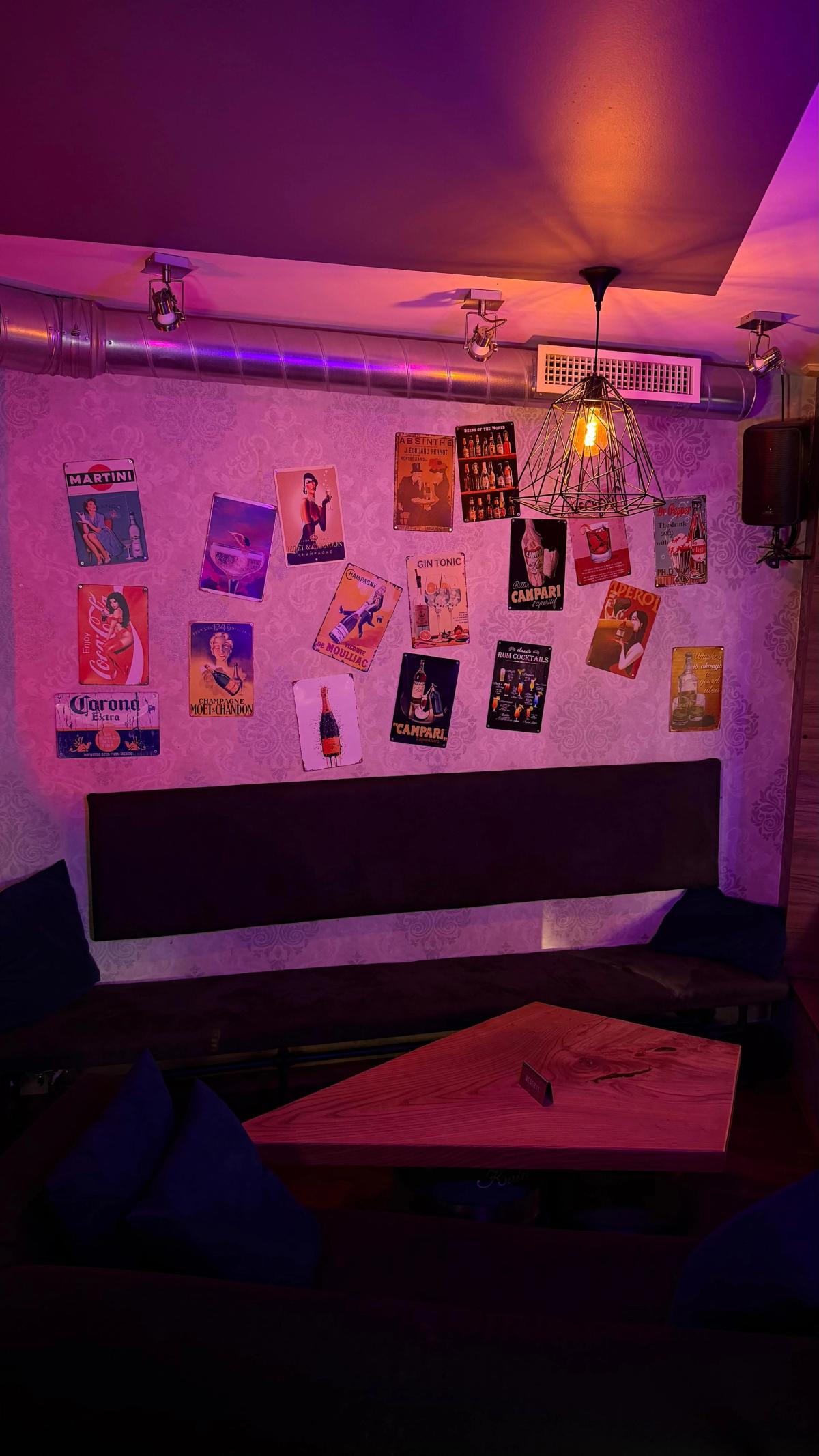 Spot Kafe neon lounge with posters wall art