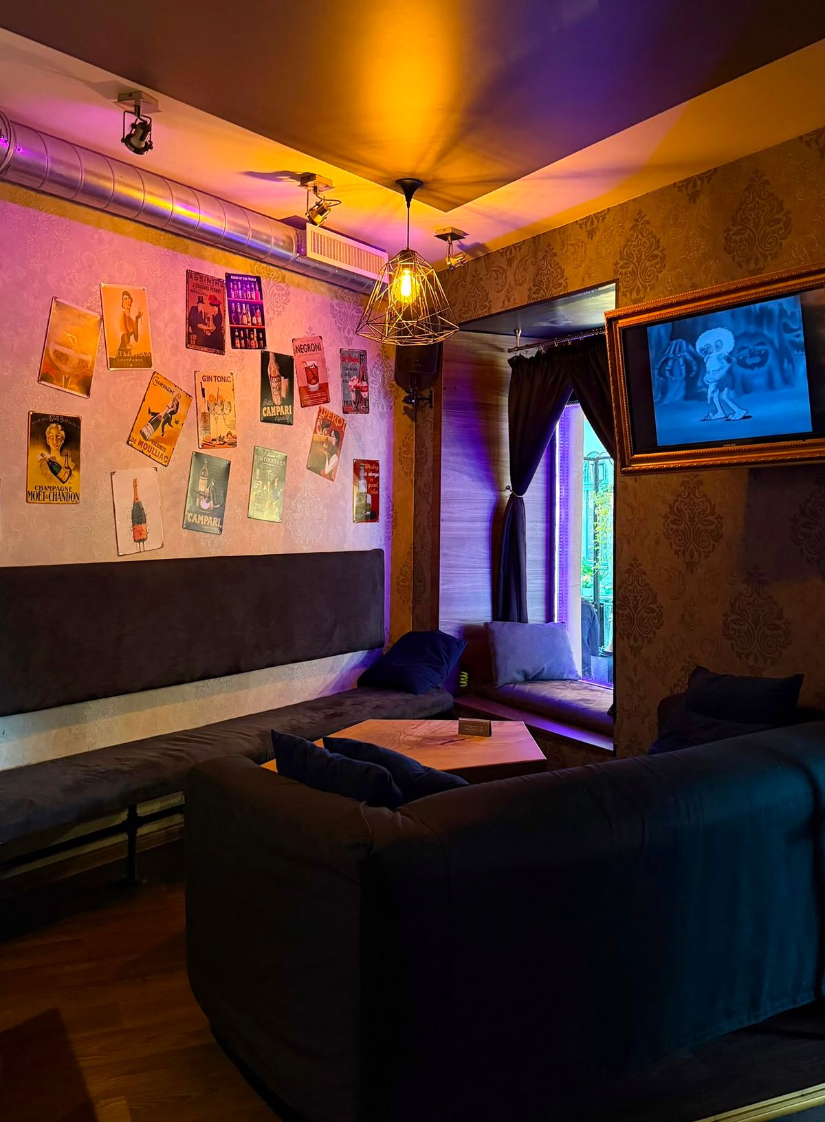 Spot Kafe neon lounge with posters wall art