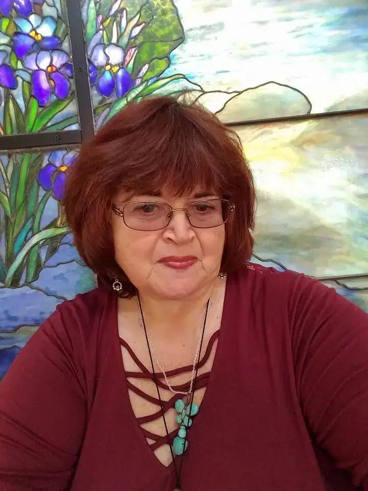 Rev. Berta Kay in a red top at a community event