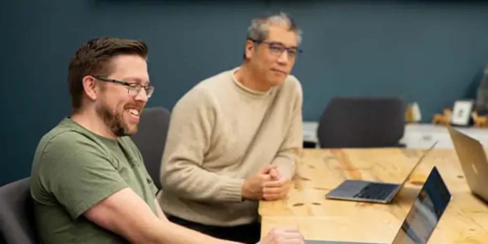 Tech workers in an office meeting room