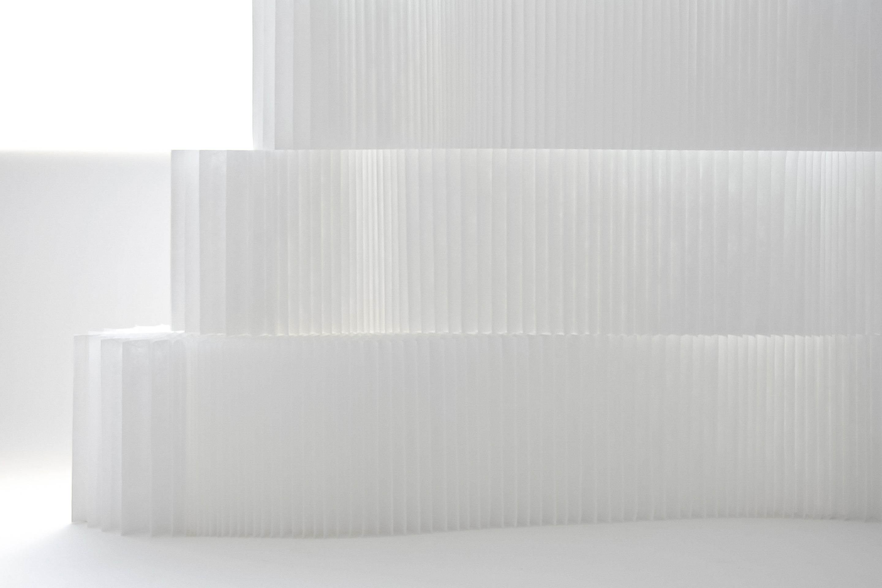 Translucent white textile transmits natural light beautifully, and comes alive when light filters through the material.