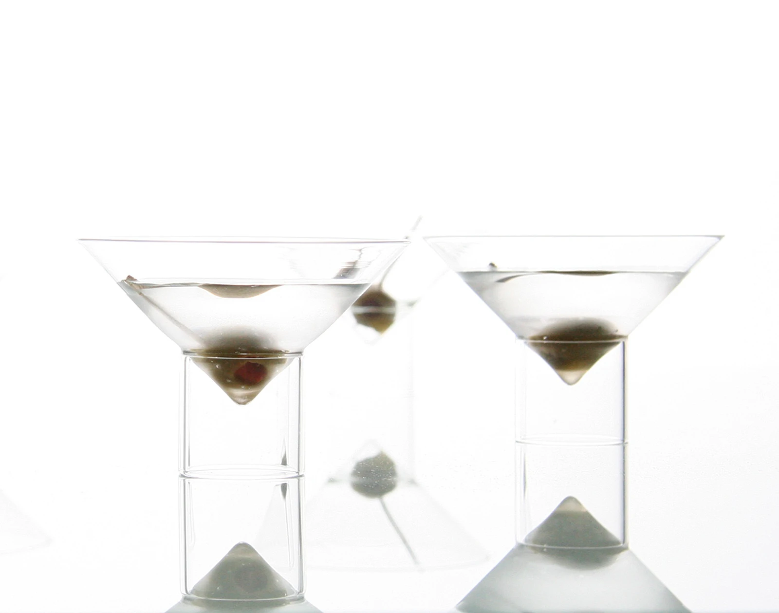 float martini glasses, filled with a dry martini and an olive from the bar