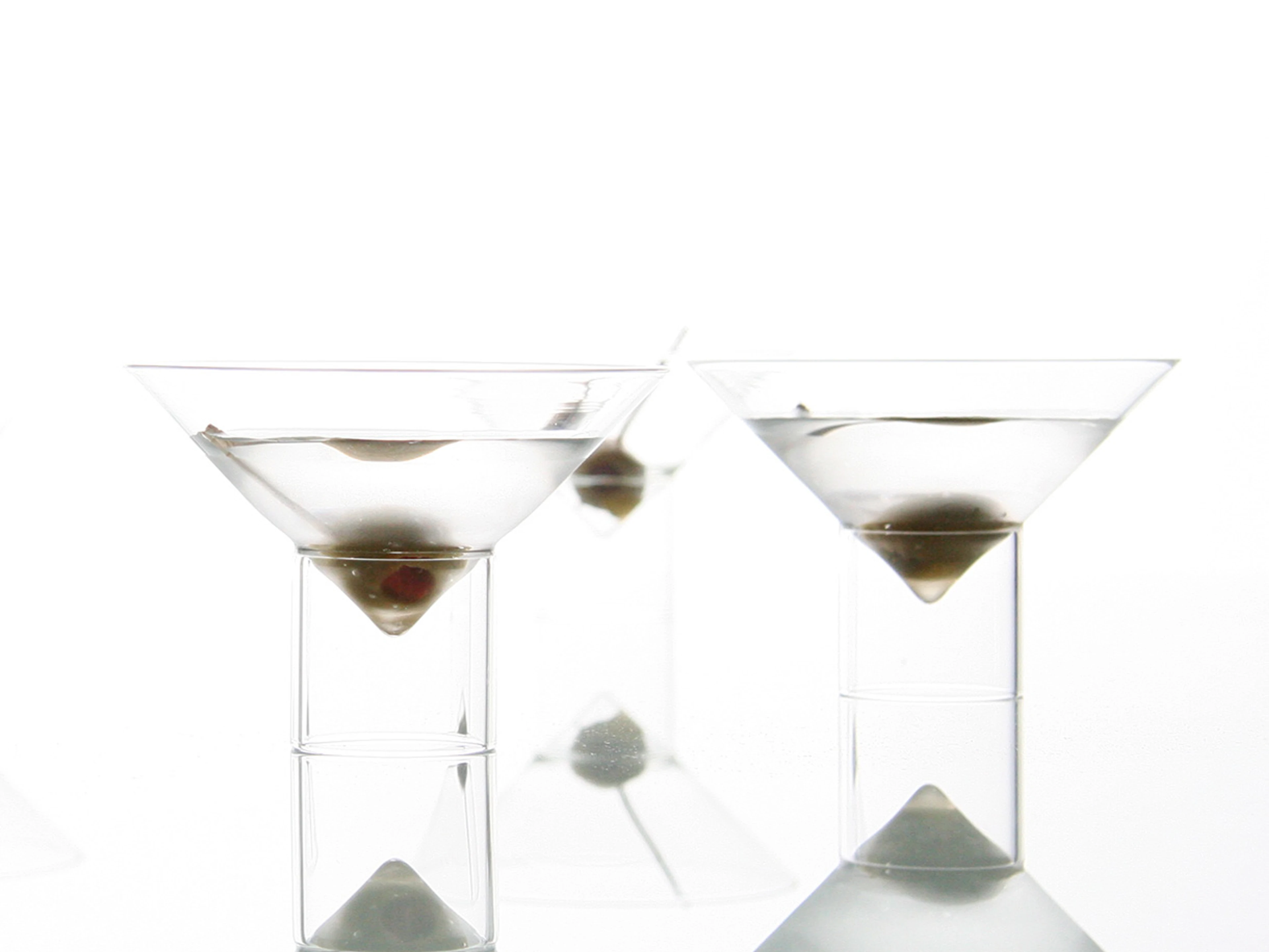 float martini glasses, filled with a dry martini and an olive from the bar