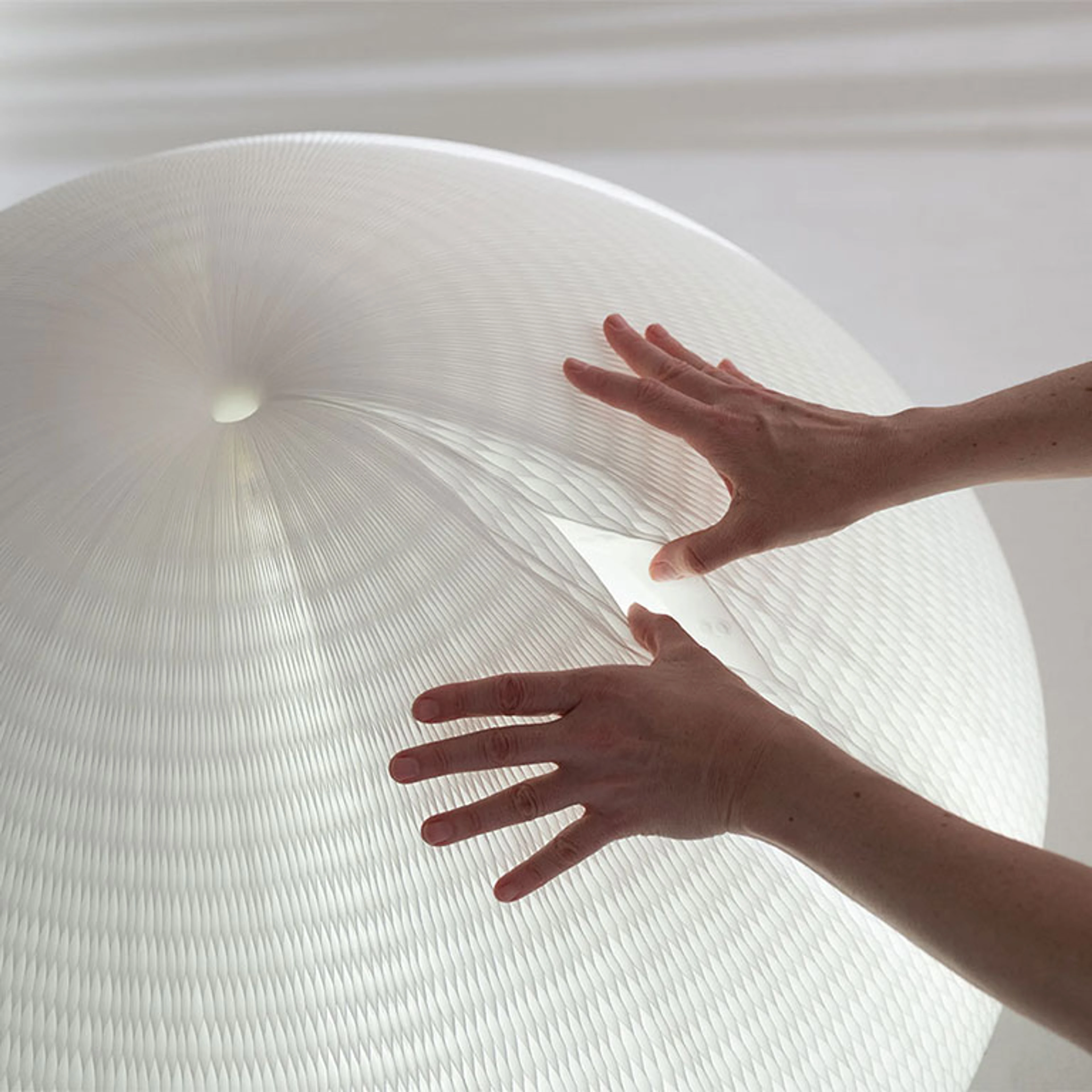 detail of magnetic connection in honeycomb paper lamp. A water resistant paper, that is actually a polyethylene non-woven textile is used for this tear resistant paper light.