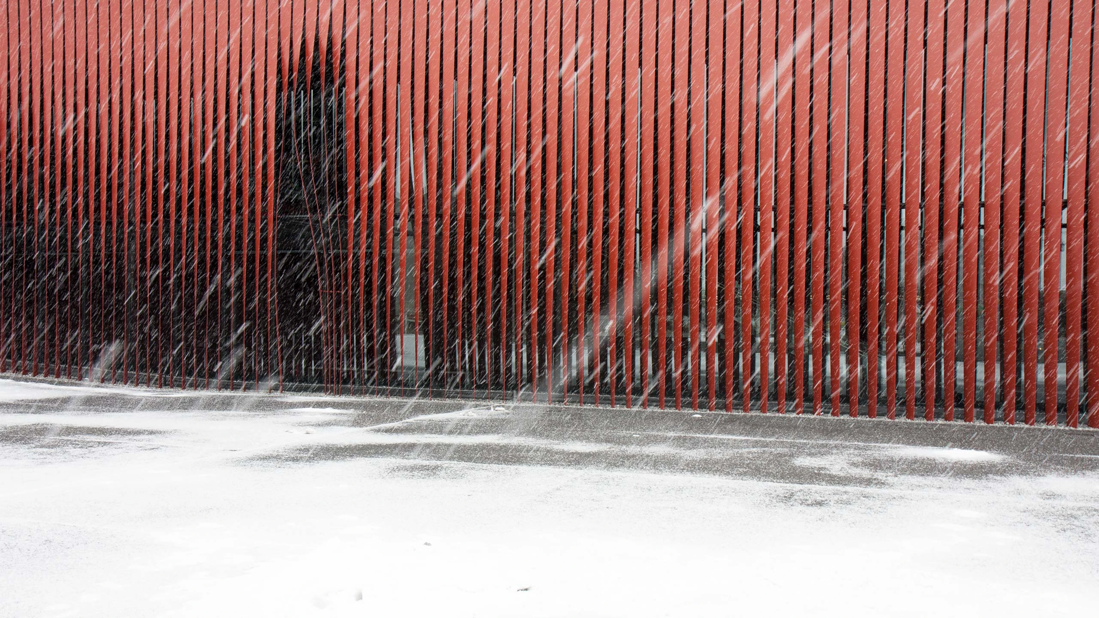A snowstorm emphasizes the architecture of Aomori Nebuta House.