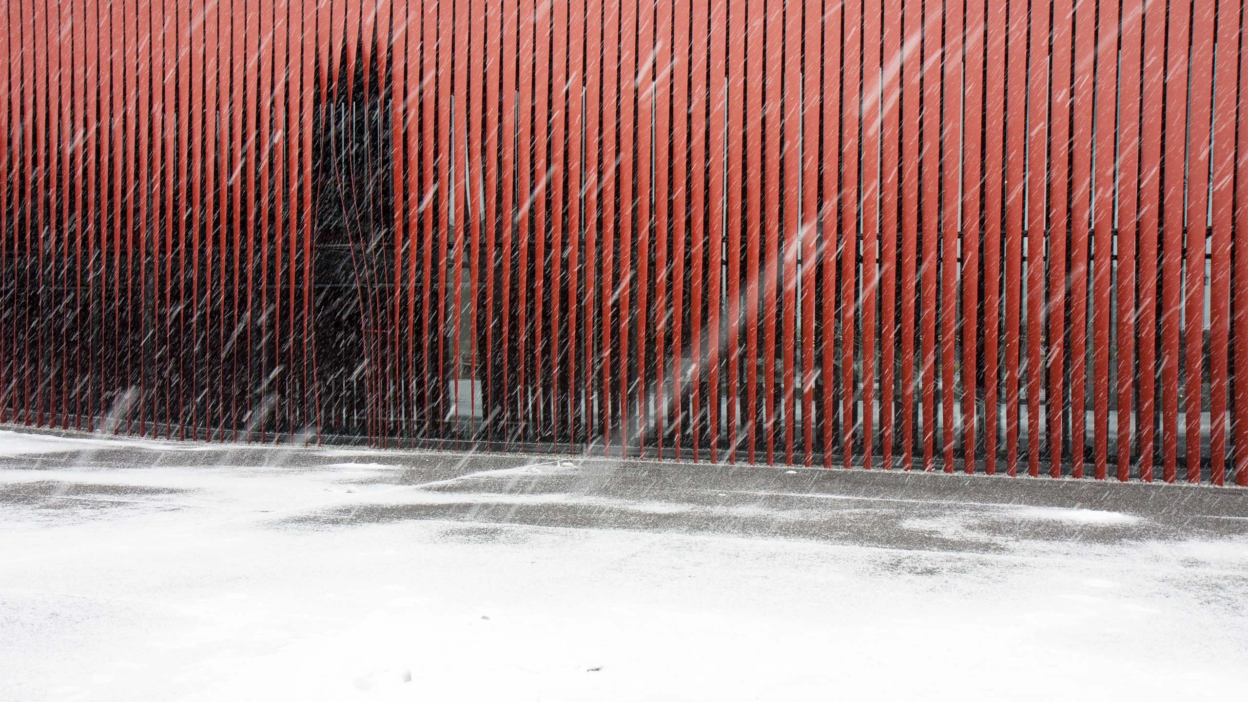 A snowstorm emphasizes the architecture of Aomori Nebuta House.