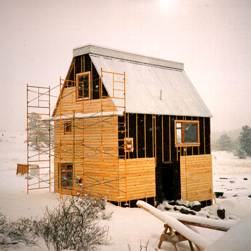 Colorado House under construction. A thick layer of snow carpets the landscape.
