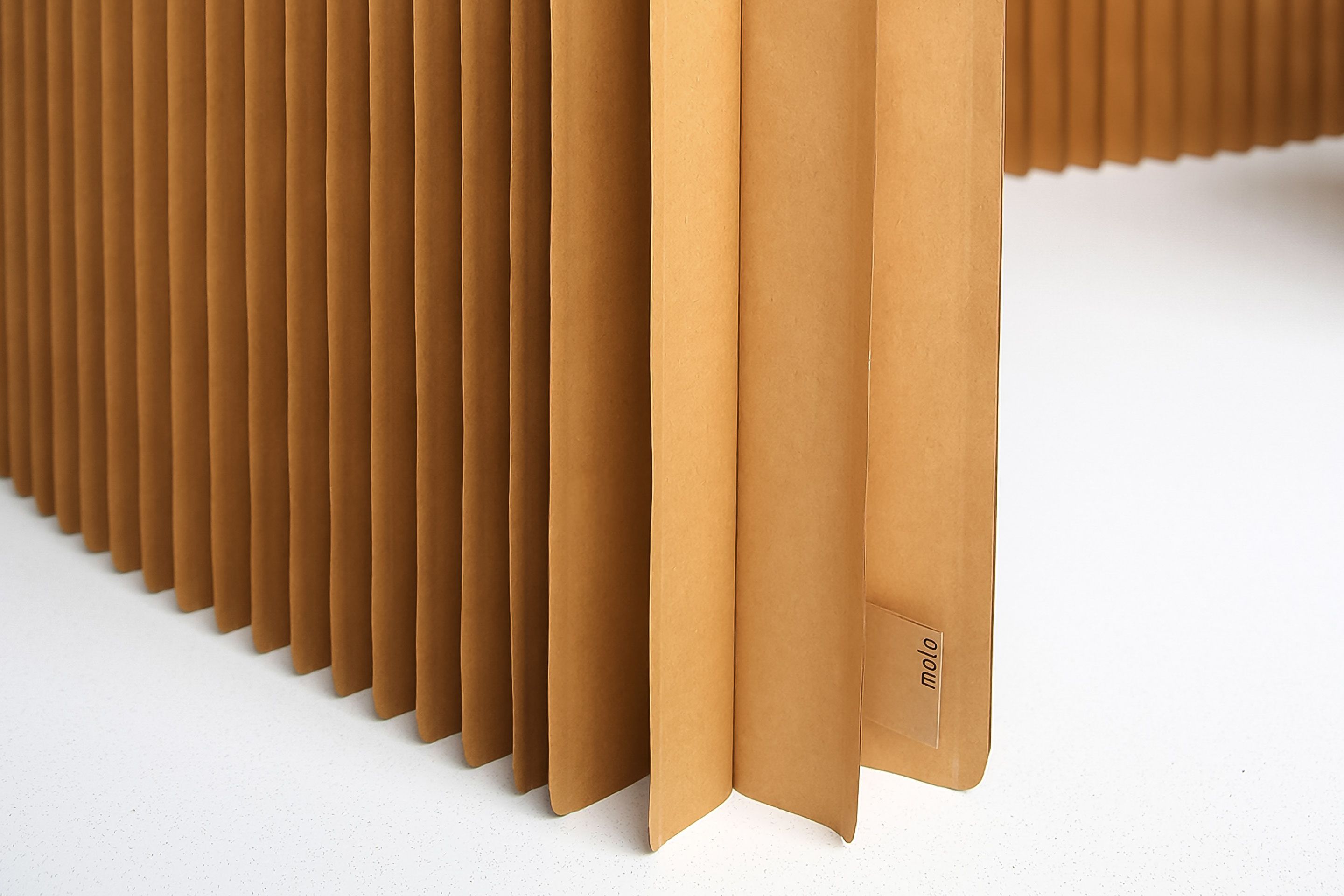 A radius cut edge on the base of softblock offers visual lightness and reduces wear over time. 