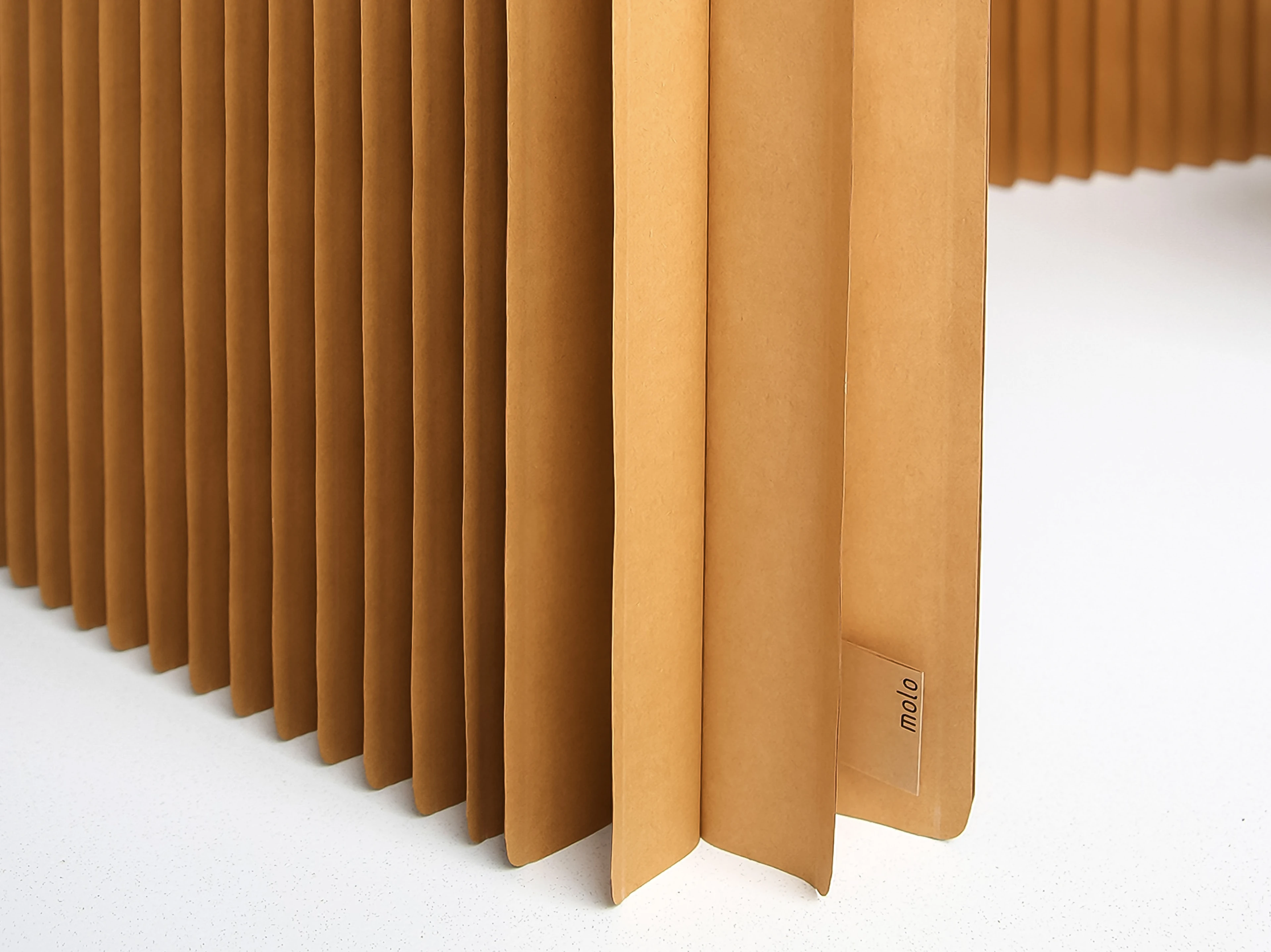 A radius cut edge on the base of softblock offers visual lightness and reduces wear over time.