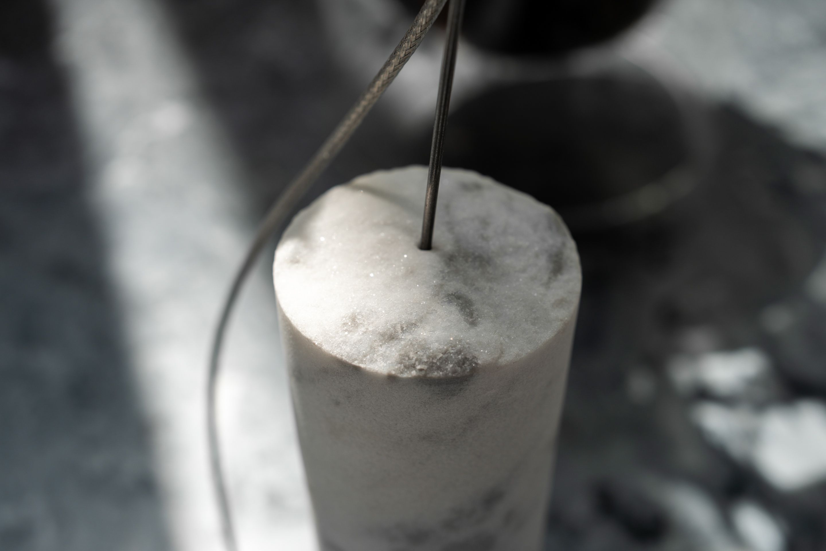 The unpolished marble base is an artifact of design history, playfully repurposed.