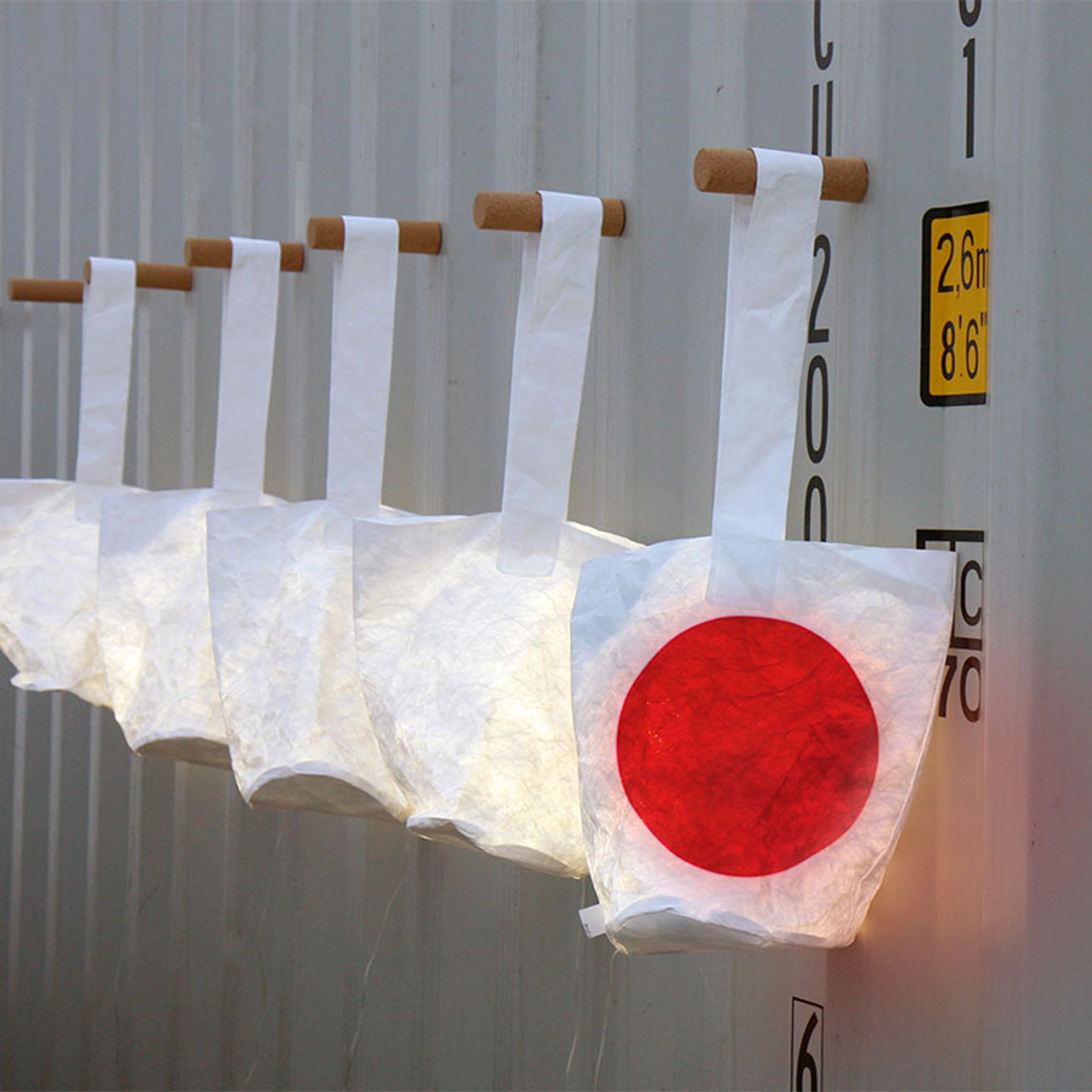 A heartfelt lantern hanging on a shipping container -paper furniture design Japan