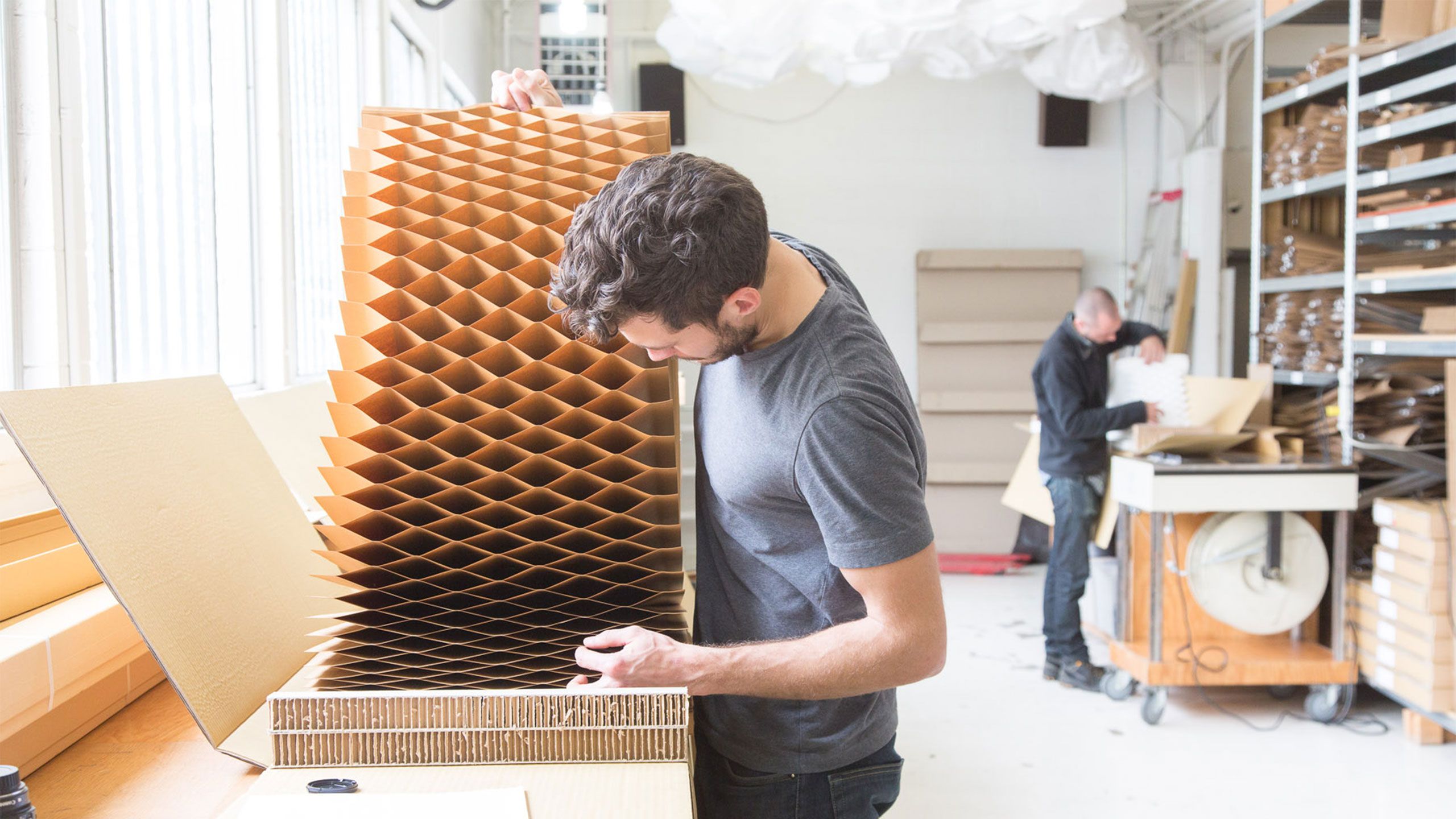 one of many careers with molo, a workshop assistant examines the honeycomb geometry of a fresh softblock