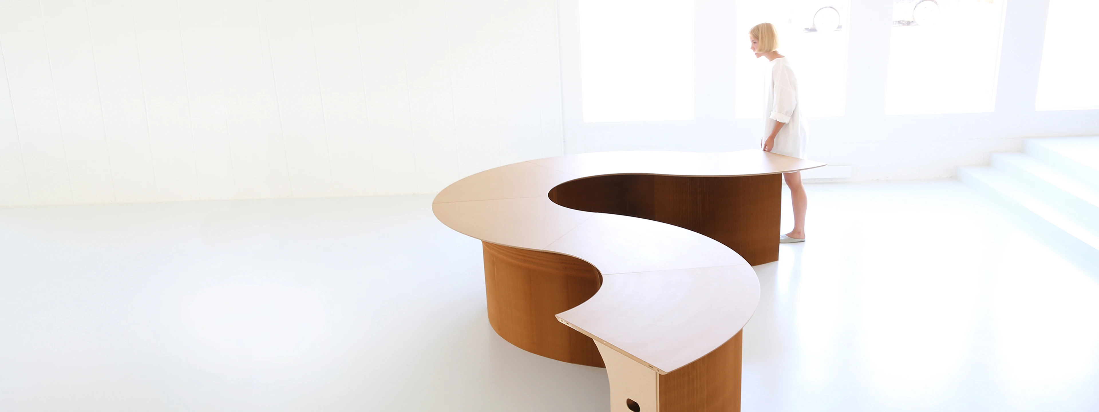 cantilever table arranged in an S-curve