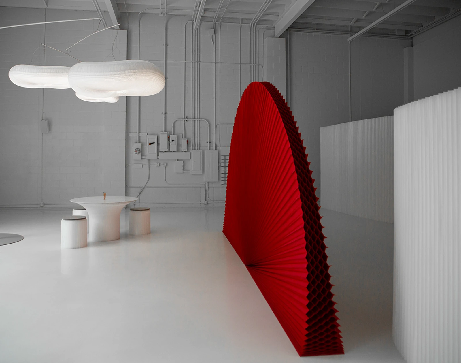 A red PMS 200 custom printed textile softwall against a natural white softwall.